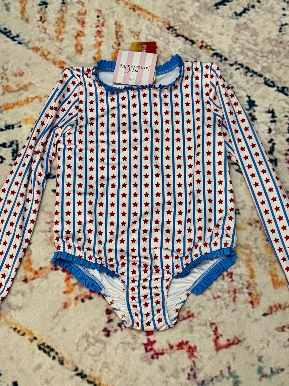 James & Lottie Girls' White and Red Star Long-Sleeve Rashguard Swimsuit